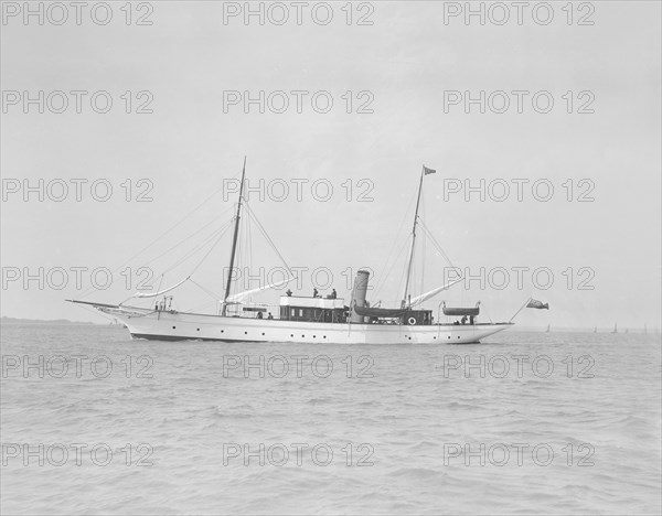 The steam yacht 'Titania' under way, 1911. Creator: Kirk & Sons of Cowes.