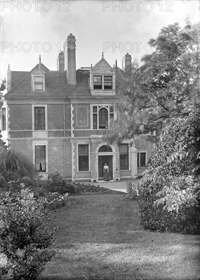House and garden, c1900. Creator: Kirk & Sons of Cowes.