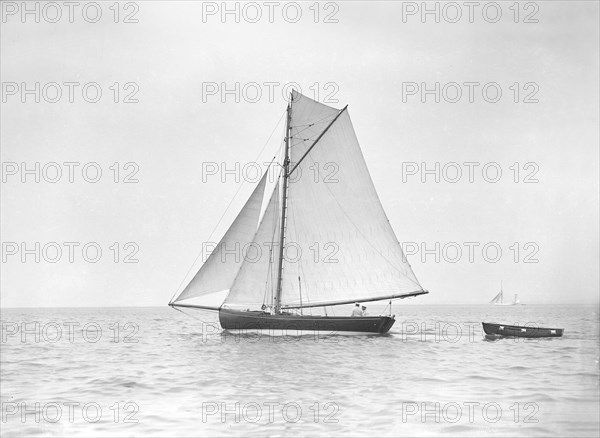 The cutter 'Jammie' under sail, 1911. Creator: Kirk & Sons of Cowes.