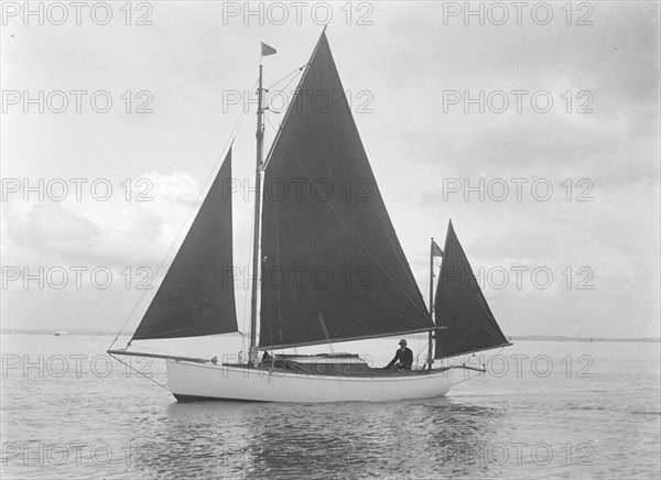 The 4 ton yawl 'Mandy' under sail, 1922. Creator: Kirk & Sons of Cowes.