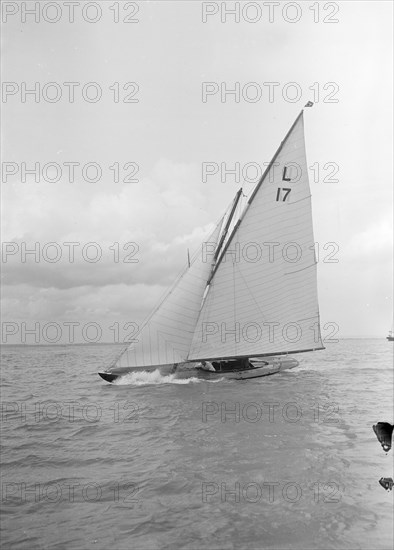 The 6 Metre 'Ejnar' (L17) breaking waves, 1912. Creator: Kirk & Sons of Cowes.