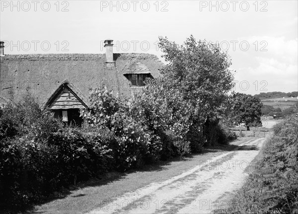 Thatched cottage, c1935. Creator: Kirk & Sons of Cowes.