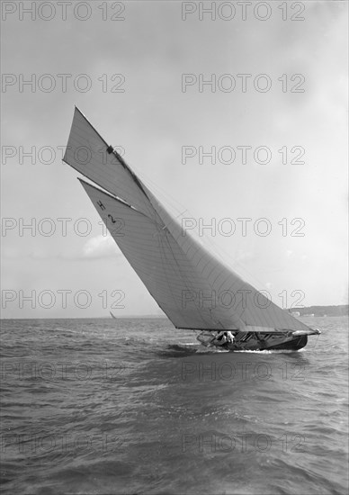 'Verbena' (H2), a gaff rig 8 Metre, sailing close-hauled, 1911. Creator: Kirk & Sons of Cowes.