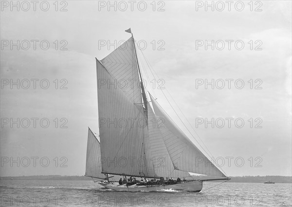 The 30 ton yawl 'Palmosa' under sail, 1911. Creator: Kirk & Sons of Cowes.