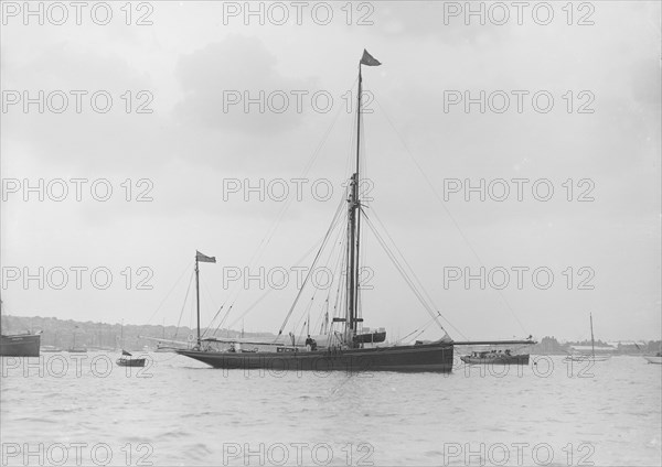 The 40 ton yawl 'Hyacinth' at anchor, 1913. Creator: Kirk & Sons of Cowes.