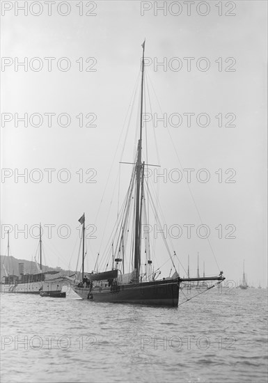 The 40 ton yawl 'Hyacinth' at anchor, 1913. Creator: Kirk & Sons of Cowes.