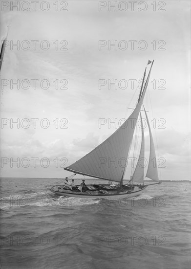 The cutter 'Nanette' sailing close-hauled, 1911. Creator: Kirk & Sons of Cowes.