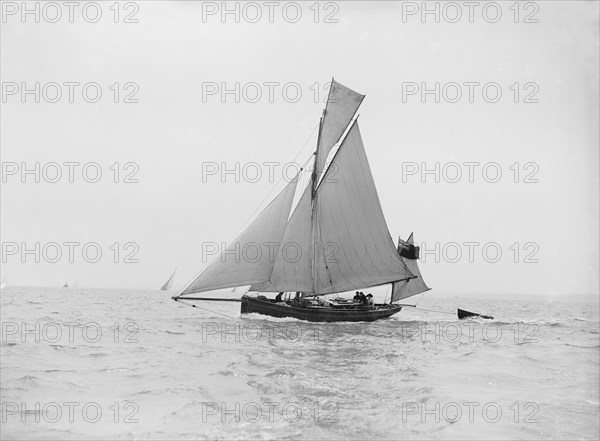 The yawl 'Lola' under sail, 1913. Creator: Kirk & Sons of Cowes.