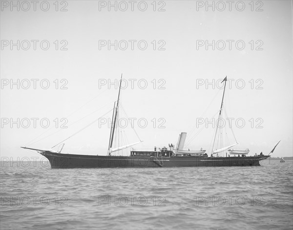 The steam yacht 'Boadicea' at anchor. Creator: Kirk & Sons of Cowes.