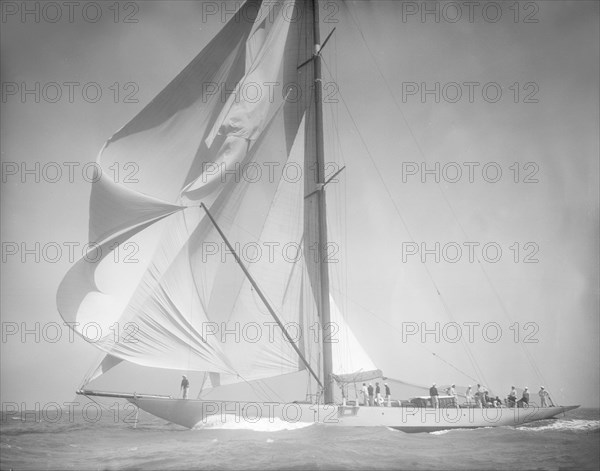 Spinnaker flying on unknown yacht. Creator: Kirk & Sons of Cowes.