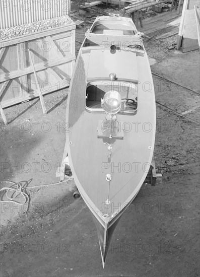 Motor launch in boatyard, 1913. Creator: Kirk & Sons of Cowes.