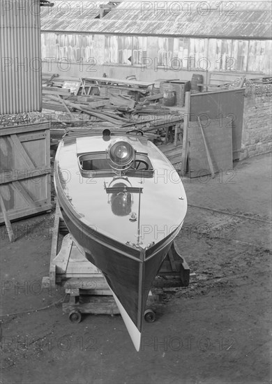 Motor launch in boatyard, 1913. Creator: Kirk & Sons of Cowes.