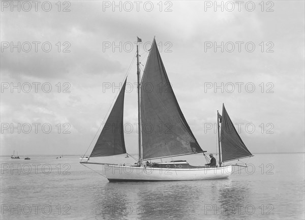 The 4 ton yawl 'Mandy' under sail, 1922. Creator: Kirk & Sons of Cowes.