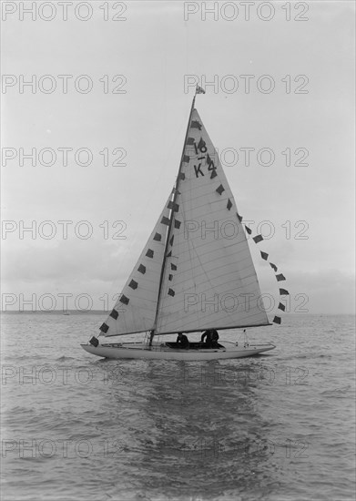 Saling yacht 'Asphodel' (K5) with prize flags, 1922. Creator: Kirk & Sons of Cowes.