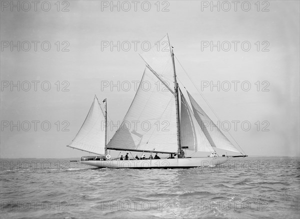 The yawl 'Nevada' under sail, 1911. Creator: Kirk & Sons of Cowes.