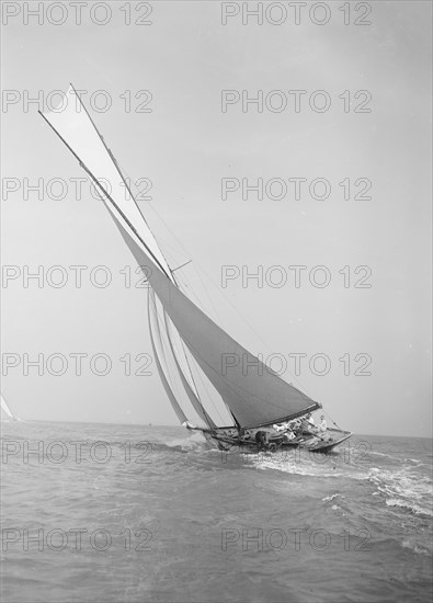 The 45 ton cutter 'Camellia' sailing close-hauled, 1911. Creator: Kirk & Sons of Cowes.