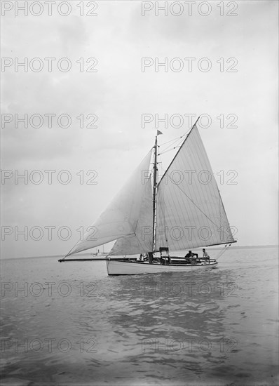 The cutter 'Blue Bird' under sail, 1934. Creator: Kirk & Sons of Cowes.