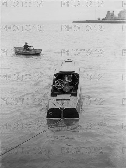 21 Footer motor launch showing engines, 1914. Creator: Kirk & Sons of Cowes.