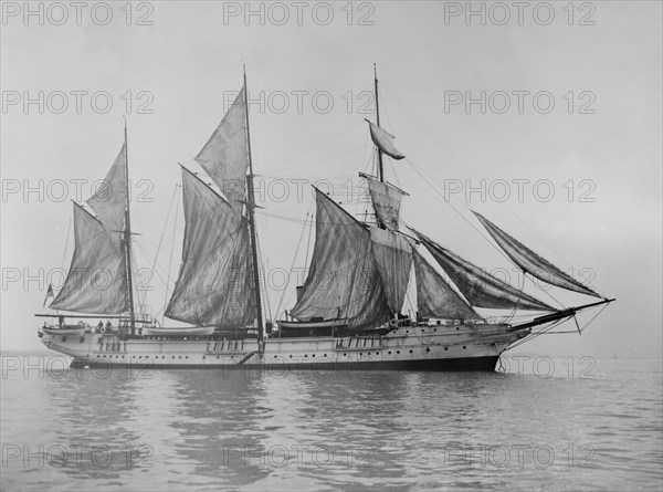 The steam yacht 'Wanderer' (later named 'Vagus') hoisting sails. Creator: Kirk & Sons of Cowes.