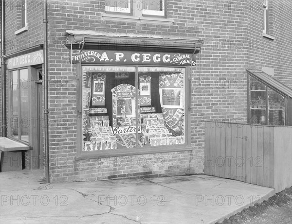 Decorated shop window of AP Gegg, c1935. Creator: Kirk & Sons of Cowes.