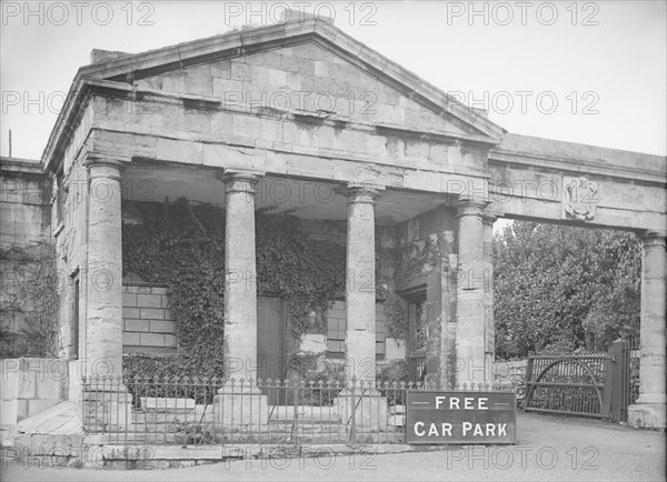 Neoclassical facade with 'Free Car Park' sign, c1935. Creator: Kirk & Sons of Cowes.