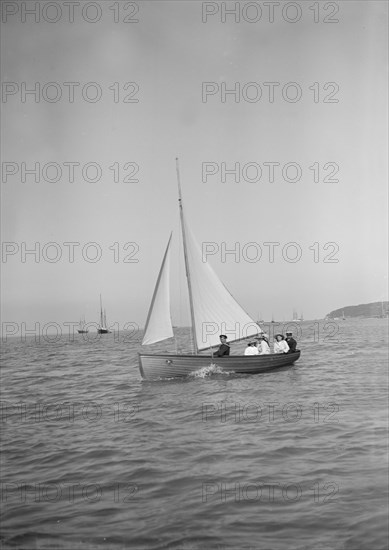 Party sailing on the Earl of Normanton's Cutter, 1911. Creator: Kirk & Sons of Cowes.