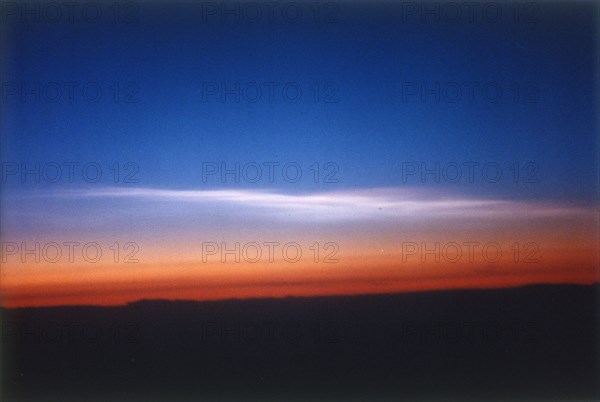 Clouds 39,000 feet north of Stavanger, Norway, seen from DC-8 plane. Creator: NASA.