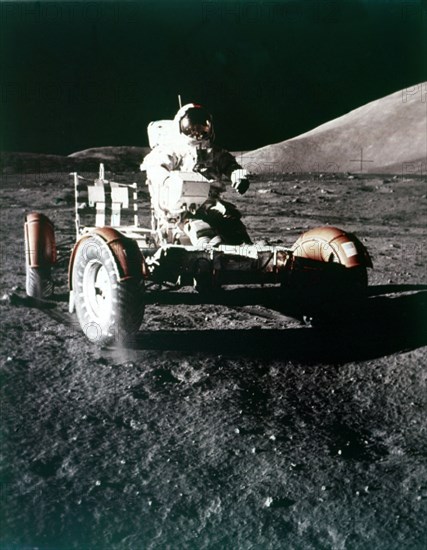 Eugene Cernan using the Rover on the lunar surface, Apollo 17 mission, December 1972. Creator: NASA.