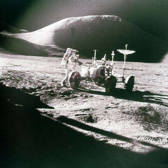 Astronaut with Lunar Roving Vehicle on the Moon, 1970s. Creator: NASA.