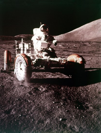 Eugene Cernan using the Rover on the lunar surface, Apollo 17 mission, December 1972. Creator: NASA.