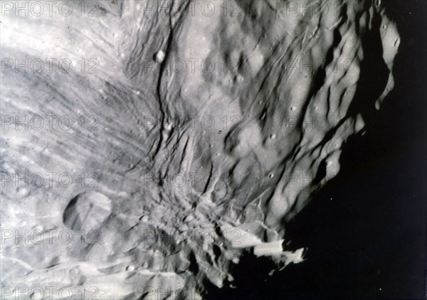 Miranda, one of the moons of Uranus, seen from Voyager 2, 24 January 1986. Creator: NASA.