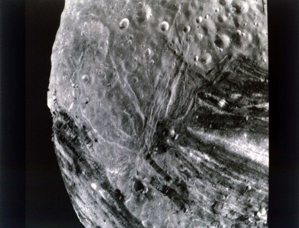 Miranda, one of the moons of Uranus, seen from Voyager 2, 24 January 1986. Creator: NASA.