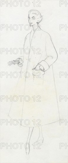 Woman in duster coat, c1950. Creator: Shirley Markham.