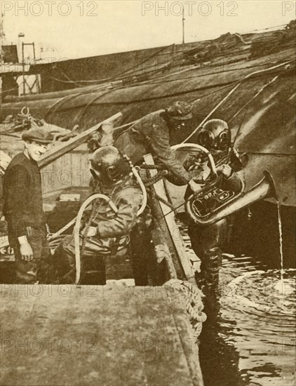 A Diver With Euphonium and Swords from the German "Kaiser" Scuttled at Scapa', c1930.