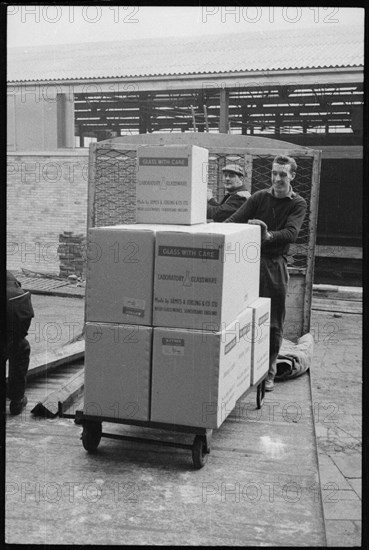 Workers moving glassware at the Wear Flint Glass Works, Alfred Street, Millfield, Sunderland, 1961