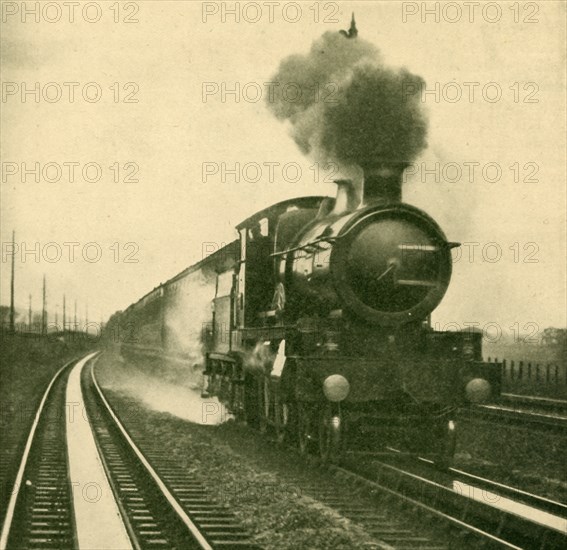 An Engine of the Star Class Picking Up Water at Speed, Goring, Great Western Railway', 1930.