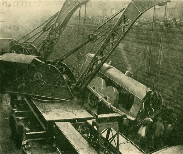 Cranes At Work After An Accident', 1930.