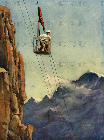 Engineers at Work on a Mountain Ropeway', c1930.