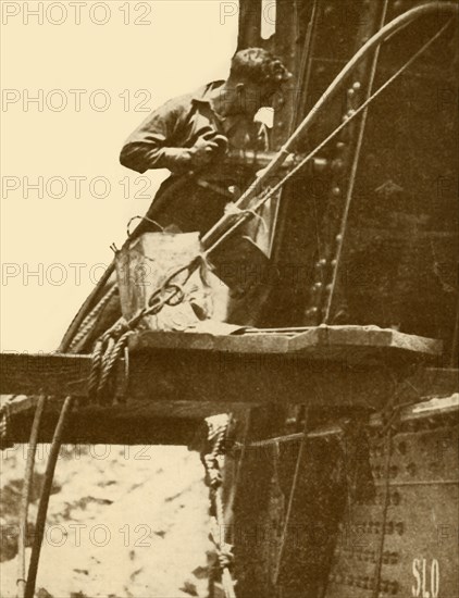 A Riveting Hammer in Operation on the Sydney Harbour Bridge', c1930.