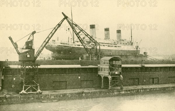 Lifitng a "Majestic" (56,551 Tons) in the Floating Dock at Southampton', c1930.