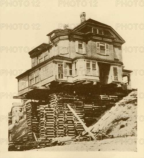 Moving a House Bodily', c1930.