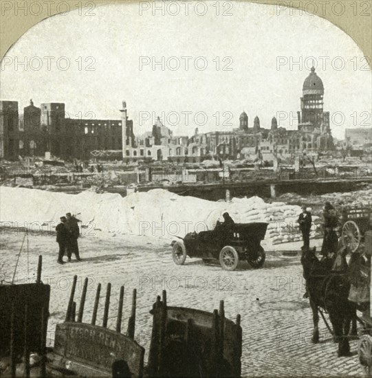 View from Moulder School distributing station, showing tons of flour on sidewalk', 1906.