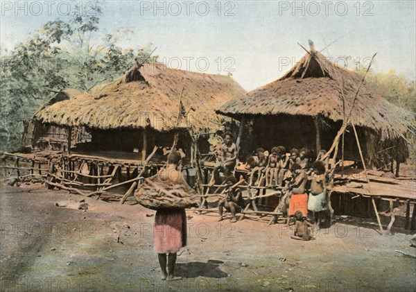 Nouvelle-Guinee. Karapuna. Village Indigene', (Papua New Guinea. Karapuna. Native Village), 1900.