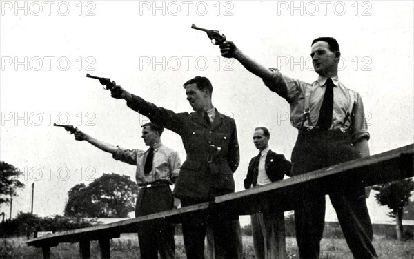 'Revolver practice at the Elementary Flying Training School',1941