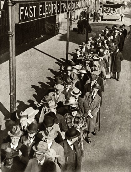 Passengers waiting at Goldhawk Road Station in London during the railway strike,1919