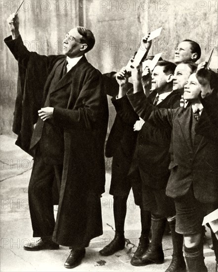 Schoolboys and teacher observing a solar eclipse, Britain