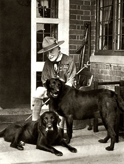 Robert Baden-Powell at home with his dogs, c1929