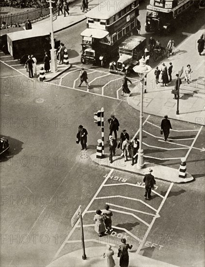 Traffic and pedestrians in Trafalgar Square, London