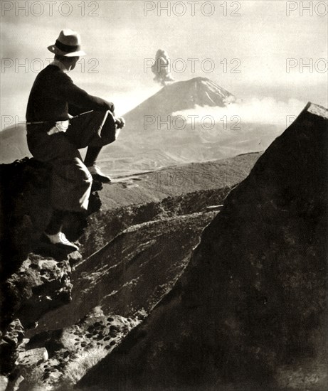 'The Rotorua district in the North Island of New Zealand - The climber is resting on a rocky promine Creator: Unknown,