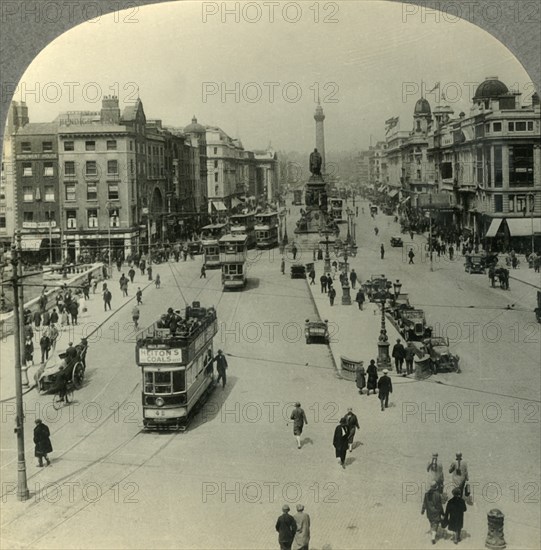 'The O'Connell Monument and the Nelson Pillar, O'Connell Street, Dublin, Ireland', c1930s. Creator: Unknown.